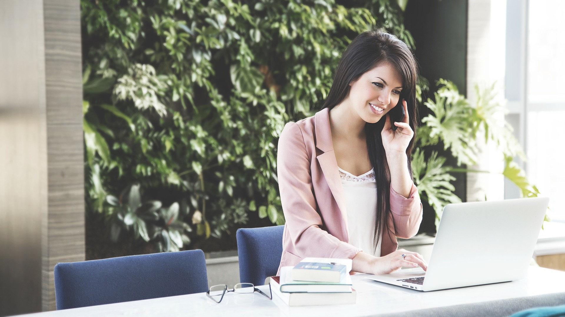 office worker women talking on phone eliminate job titles improve business culture